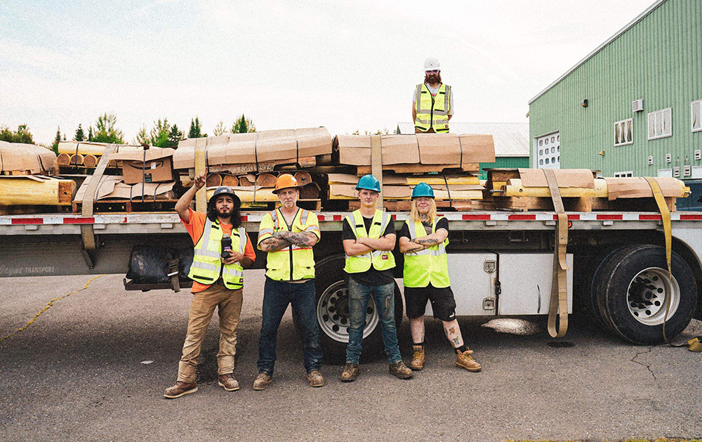 WholeTrees Forestry workers together on a logging truck